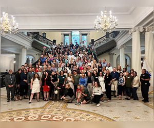 Group shot of Lobby Day 2026 on a large staircase inside the Massachusetts State House.